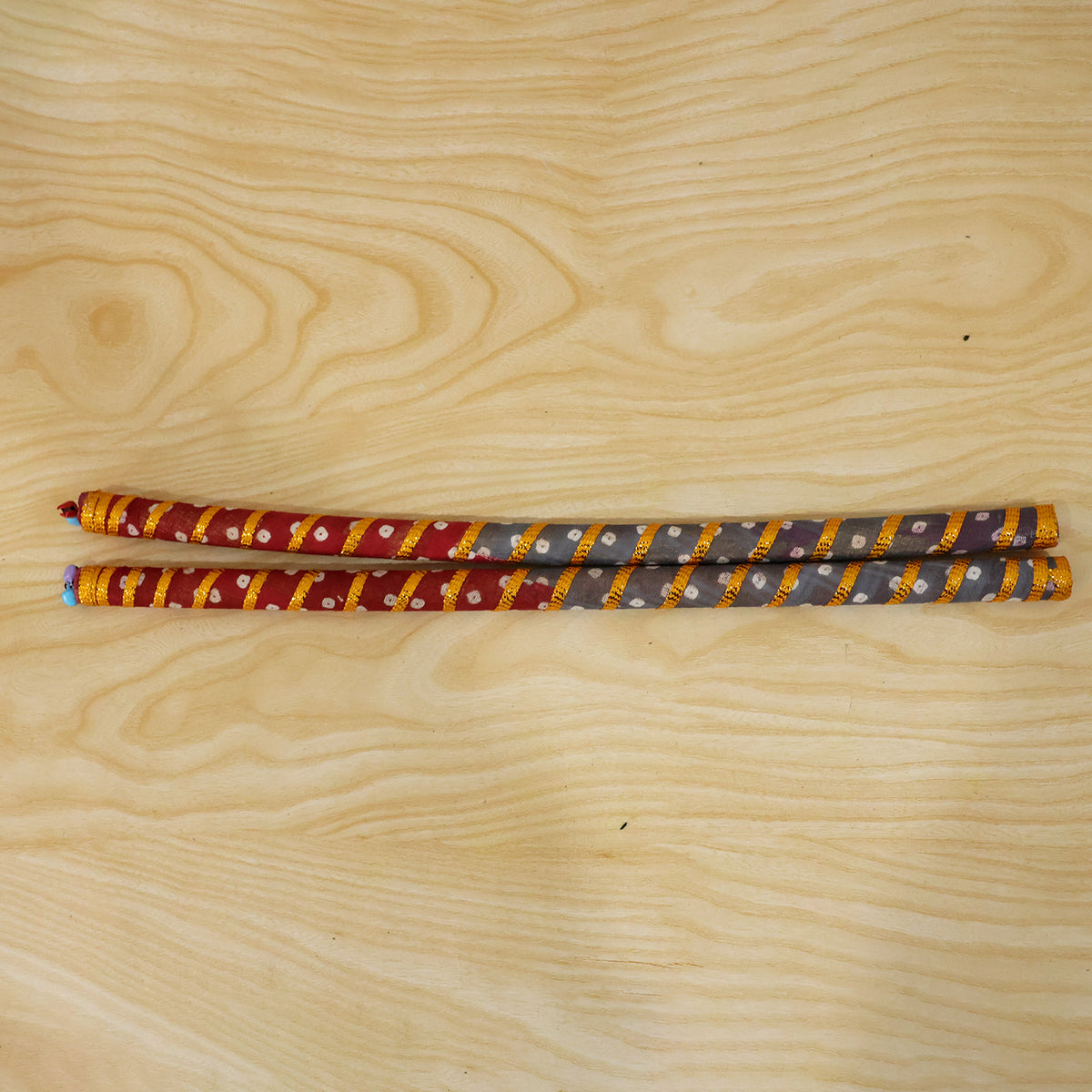 Actual photograph of two decorated dandiya sticks