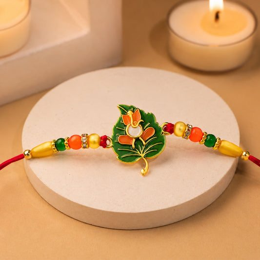 Green Tulsi Leaf Rakhi with Orange Enamel Flower and Beaded Thread