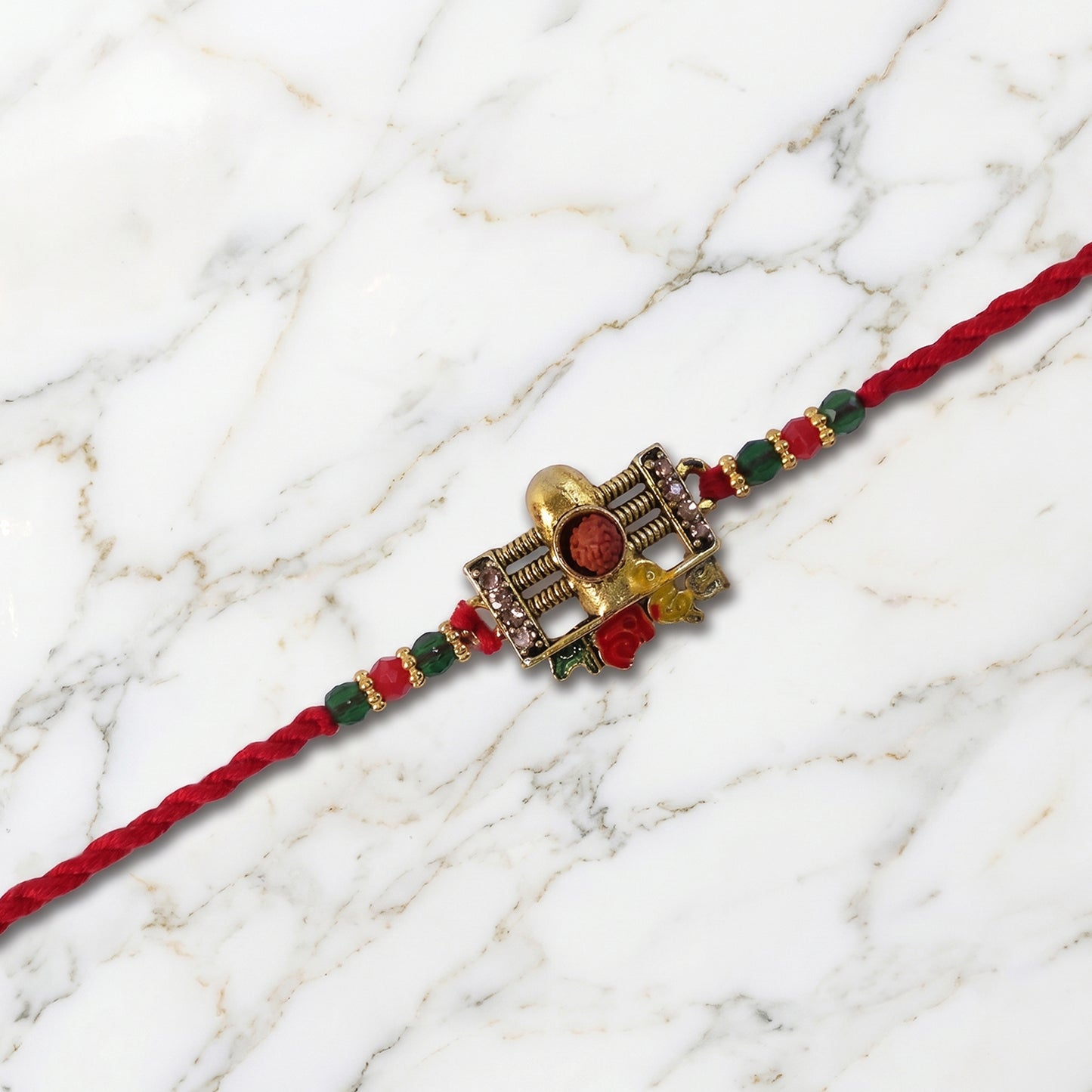 Traditional Shivling Rudraksha Rakhi with Red & Green Beads