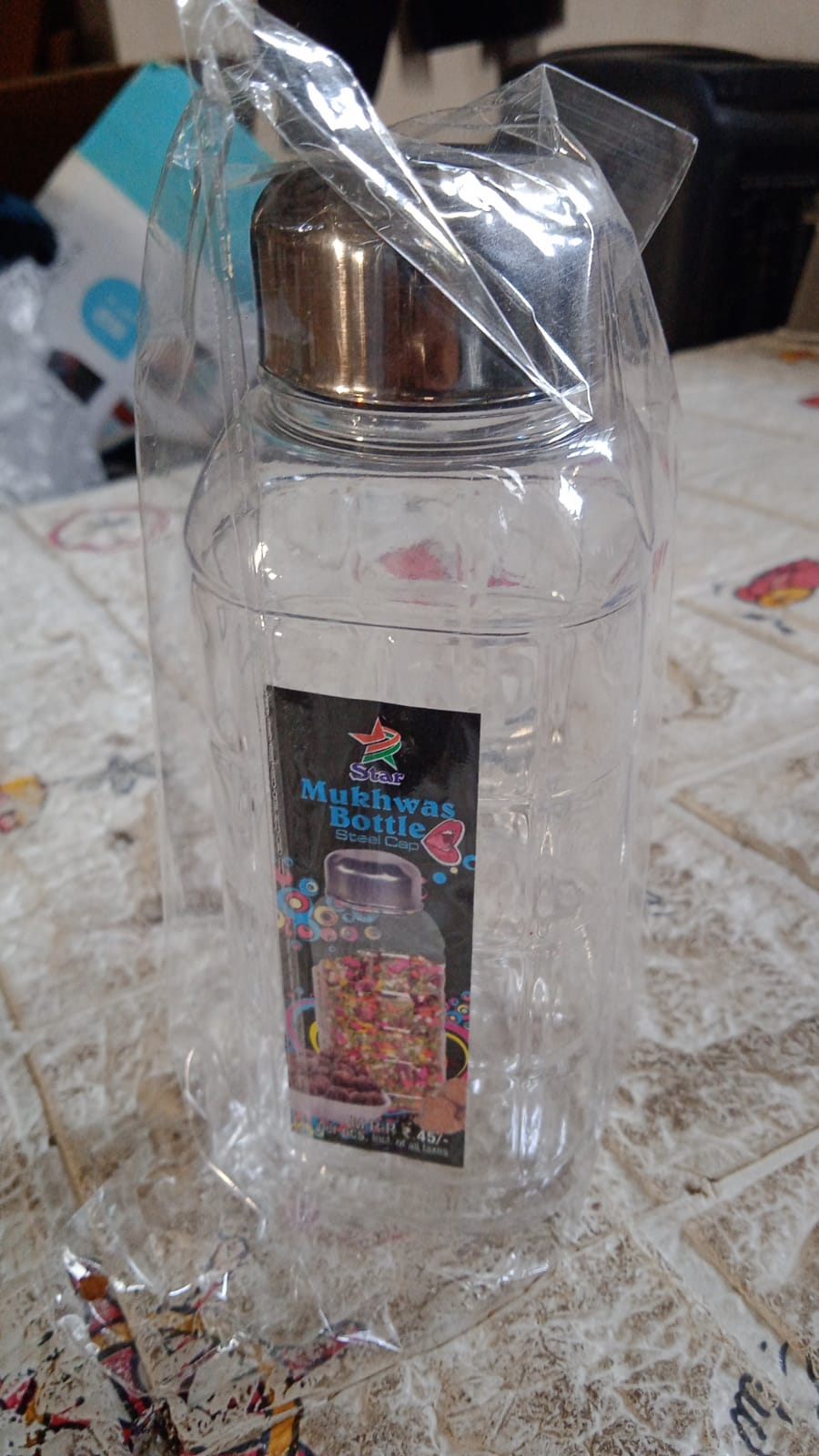 Kitchen storage bottle with steel cap upright