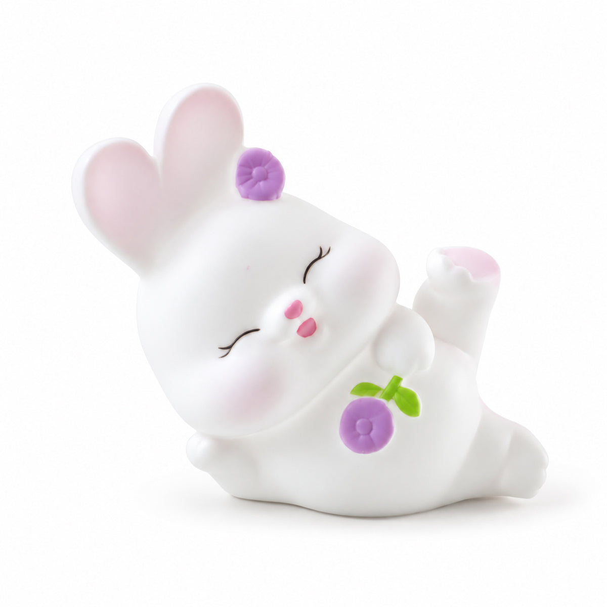 Reclining rabbit lamp on white background
