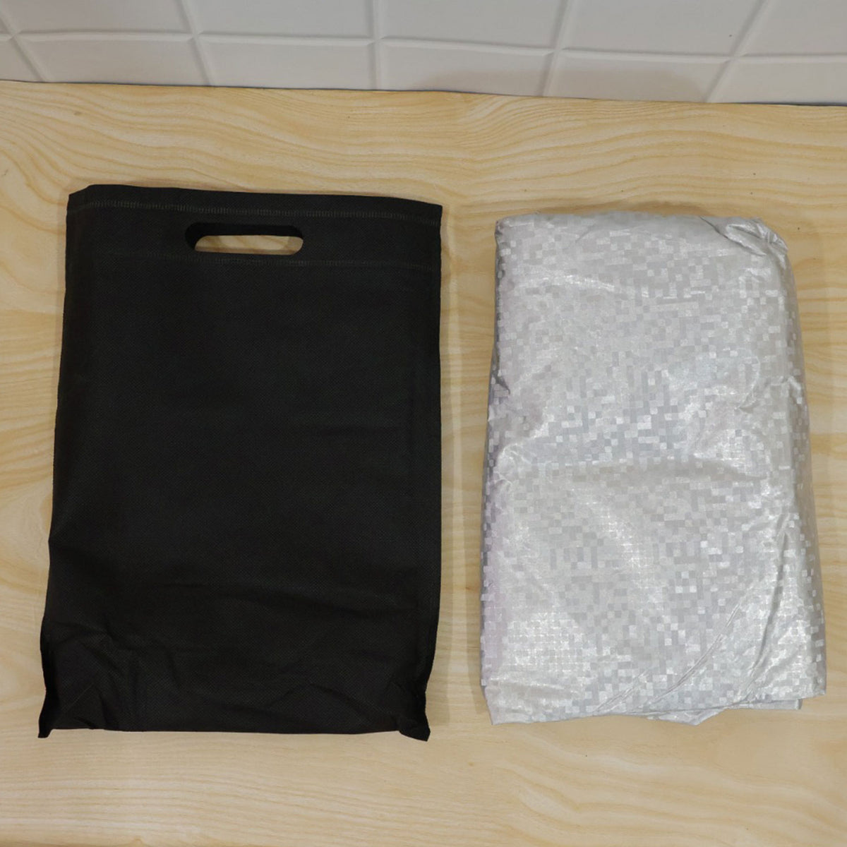 Actual folded windshield cover with cloth carry bag
