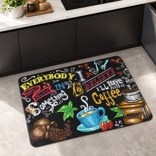 Rectangular black kitchen mat with colorful coffee-themed illustrations and text on a tiled floor.