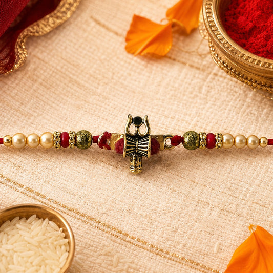 Damru Trishul Beaded Rakhi with sacred motifs for Raksha Bandhan celebration