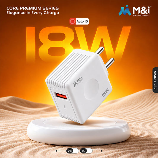 White 18W USB wall charger with red port on a round white stand in sand.
