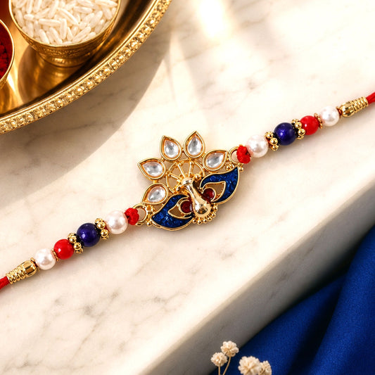 Peacock Rakhi – Elegant Pearl Beads & Bright Red Thread