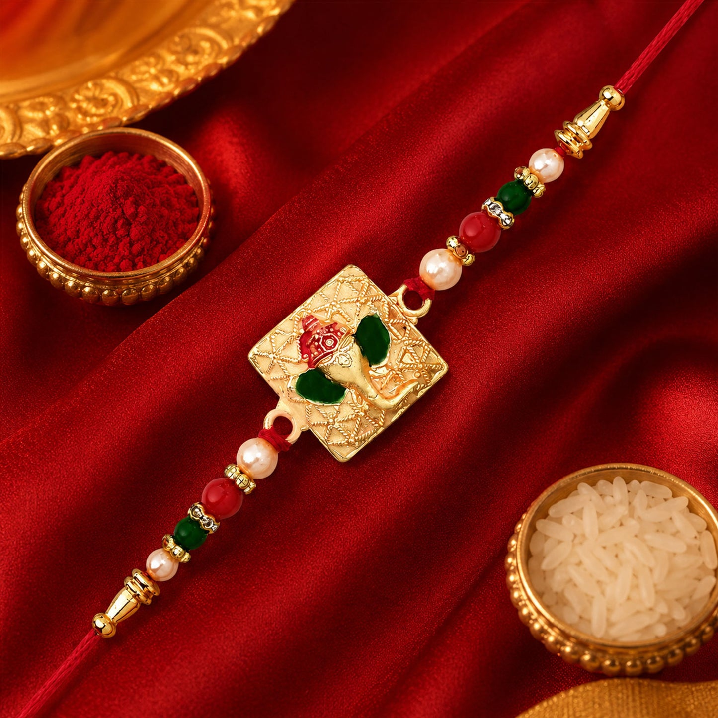 Side profile of the Golden Ganpati Rakhi tied with a traditional thread.