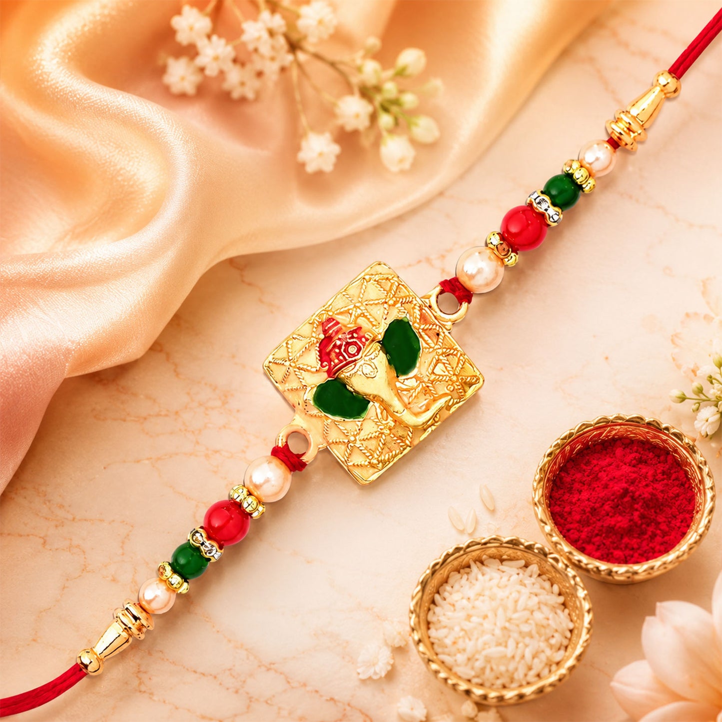 Golden Ganpati Rakhi displayed in a festive setting for Raksha Bandhan.