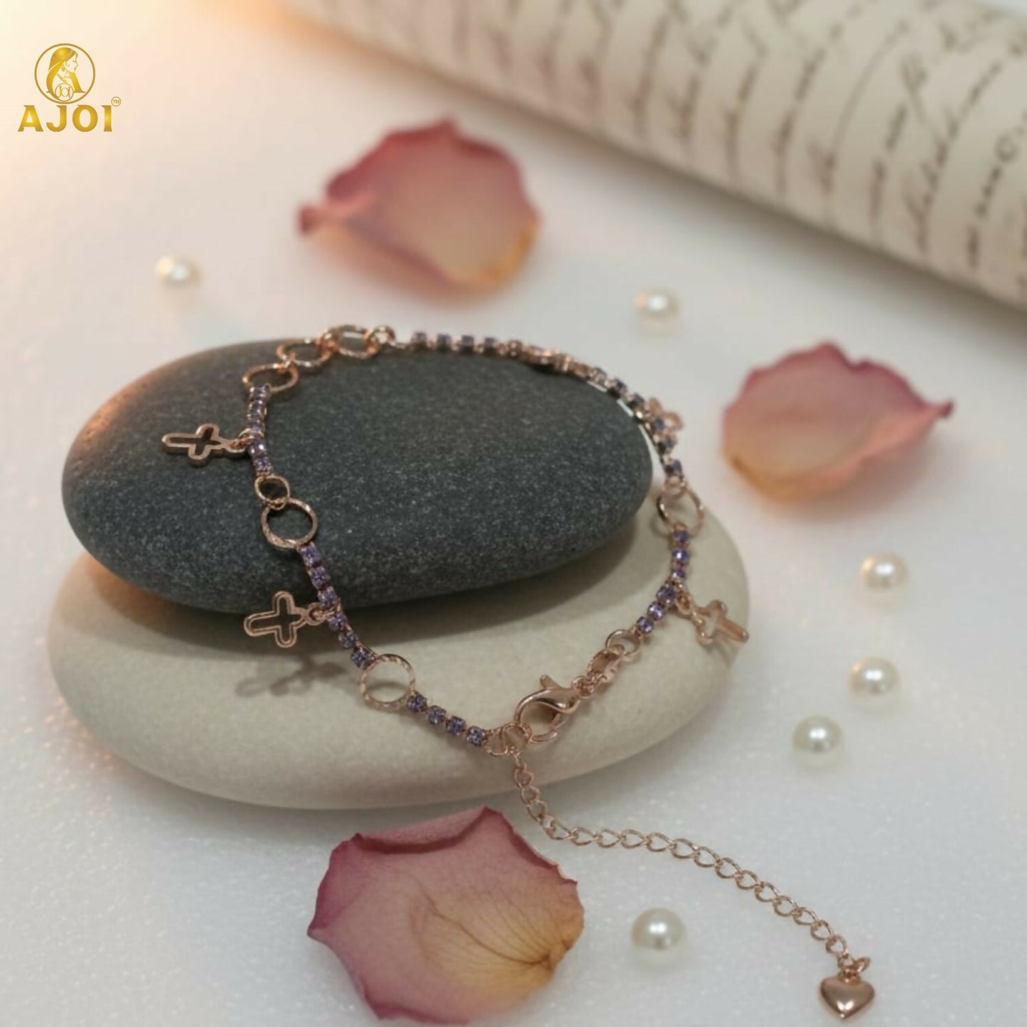Rose gold crystal charm bracelet with delicate links and charms on wrist