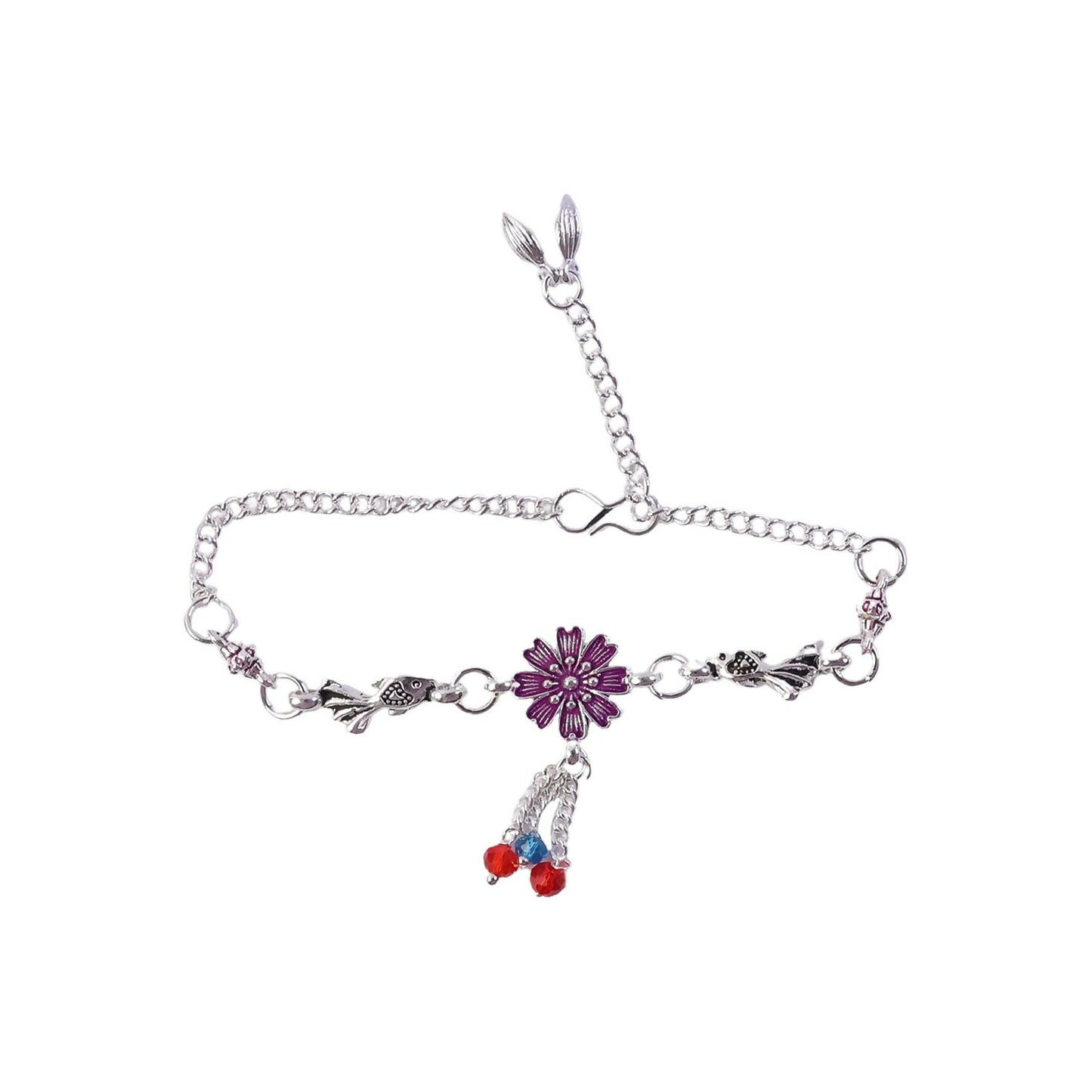Silver flower charm bracelet styled with layered accessories