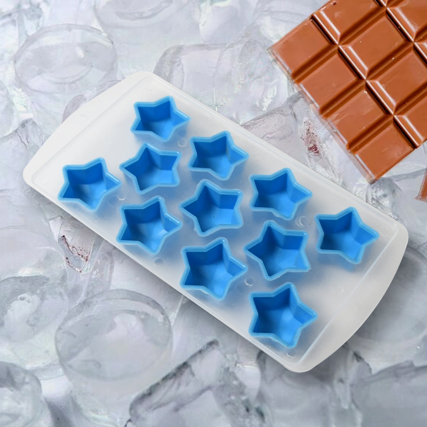 Silicone ice cube tray with various fruit shapes like star, heart, and strawberry, filled with ice.