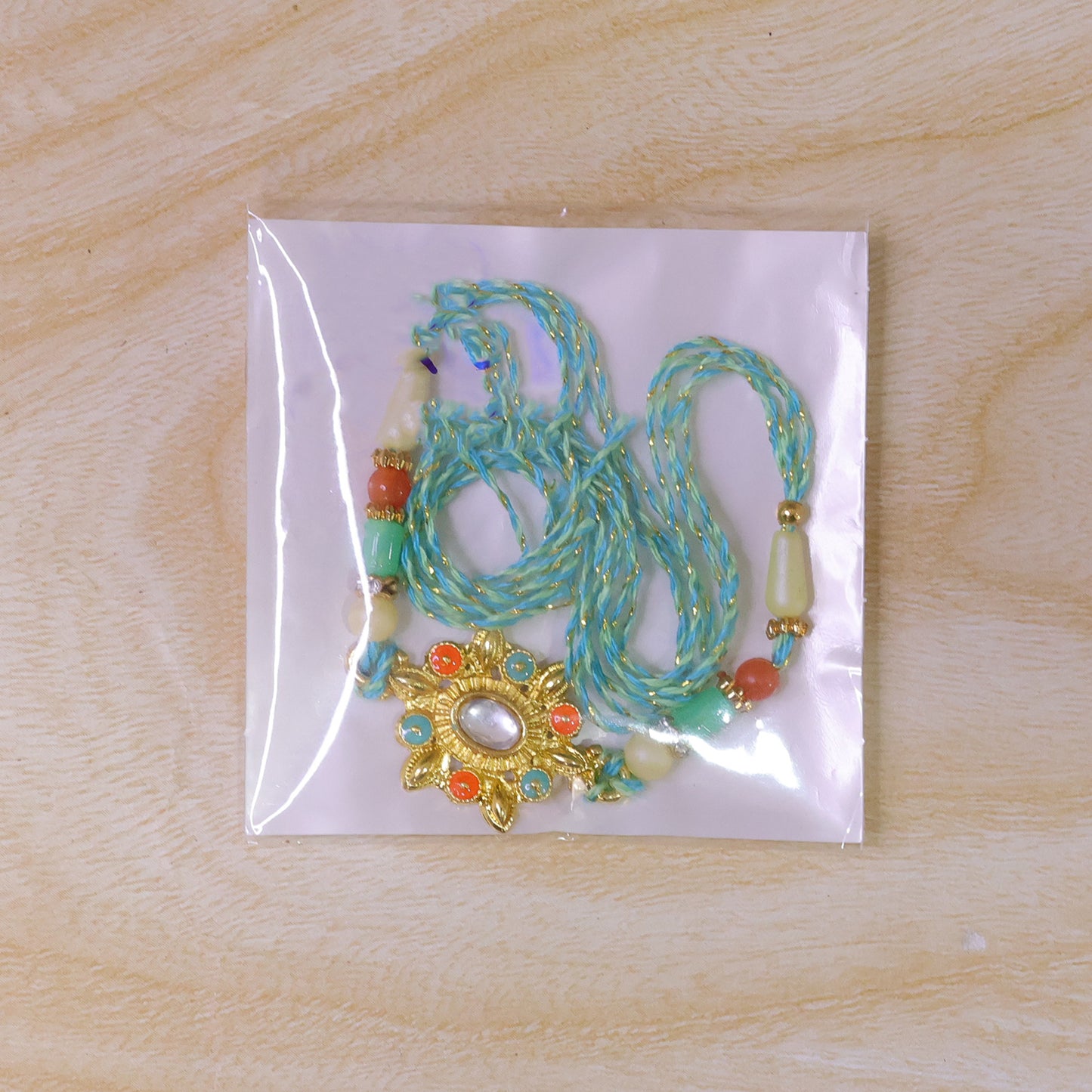 Sunflower Kundan Mirror Pendant Rakhi with Pastel Beads