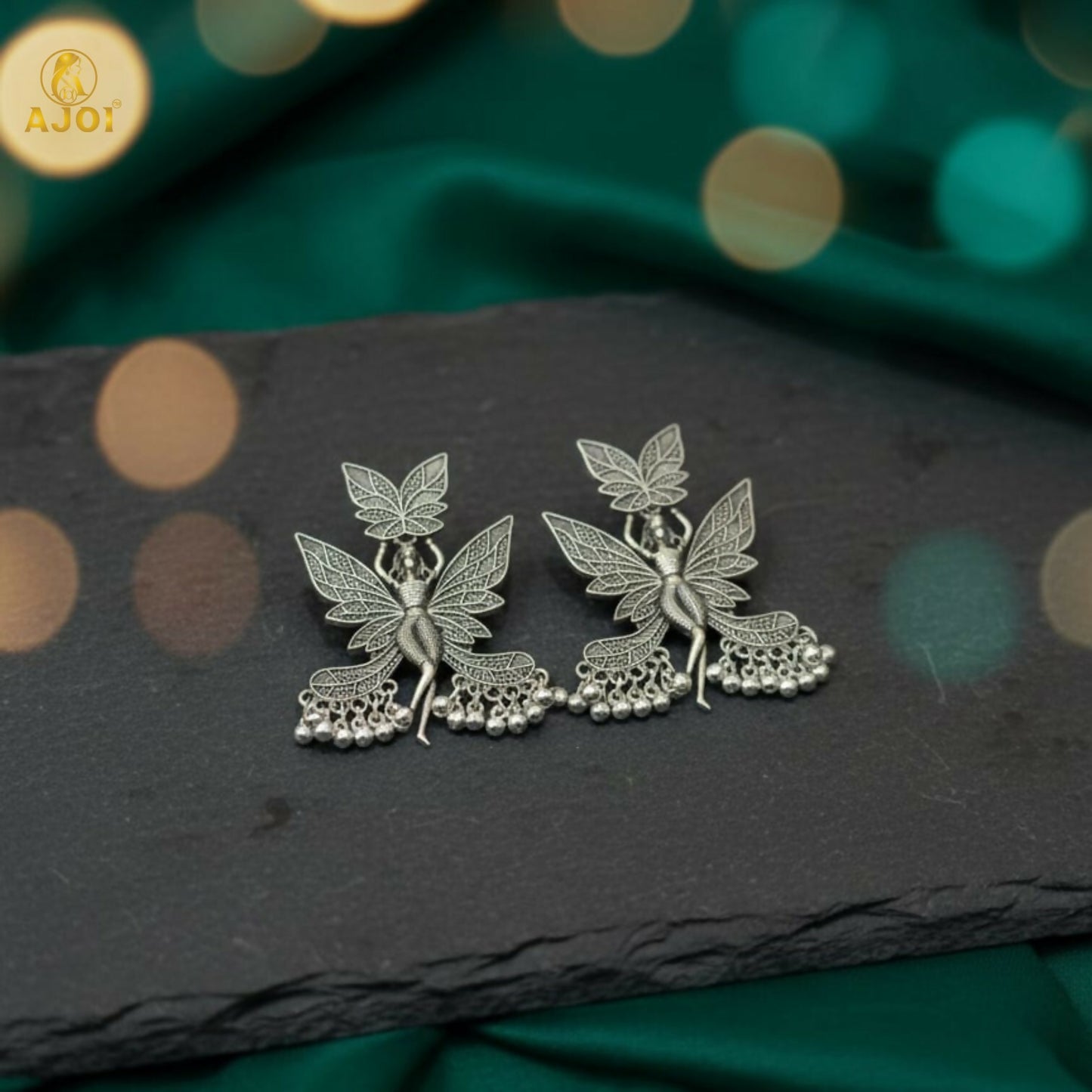 Detail of fairy silhouette on statement earring