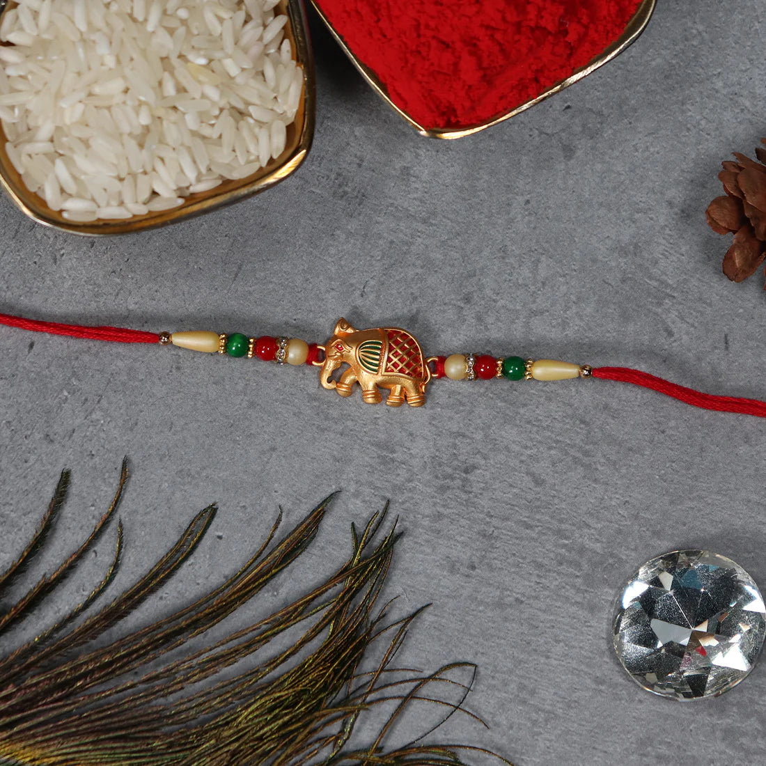 Traditional Elephant Rakhi displayed on a festive background.