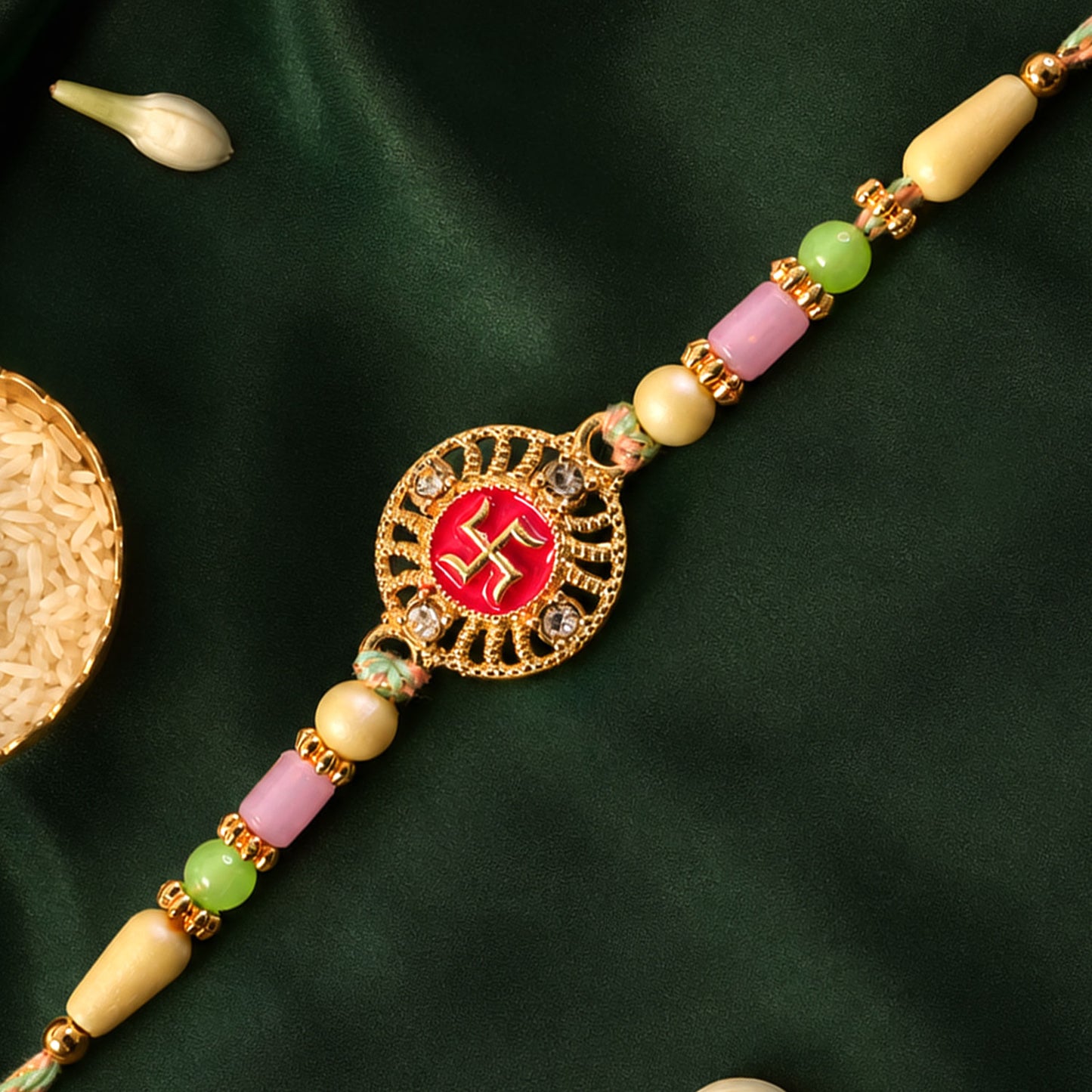 Swastik Pendant Rakhi with Kundan Stones and Pastel Beads