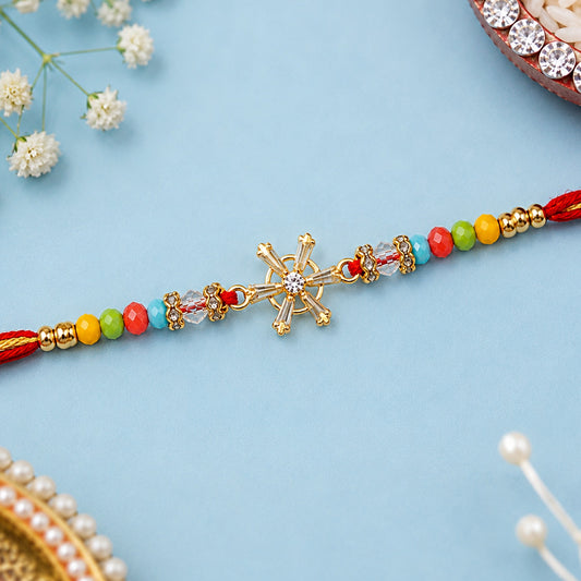 A vibrant Designer Rakhi for Brother with a sparkling snowflake AD stone design.