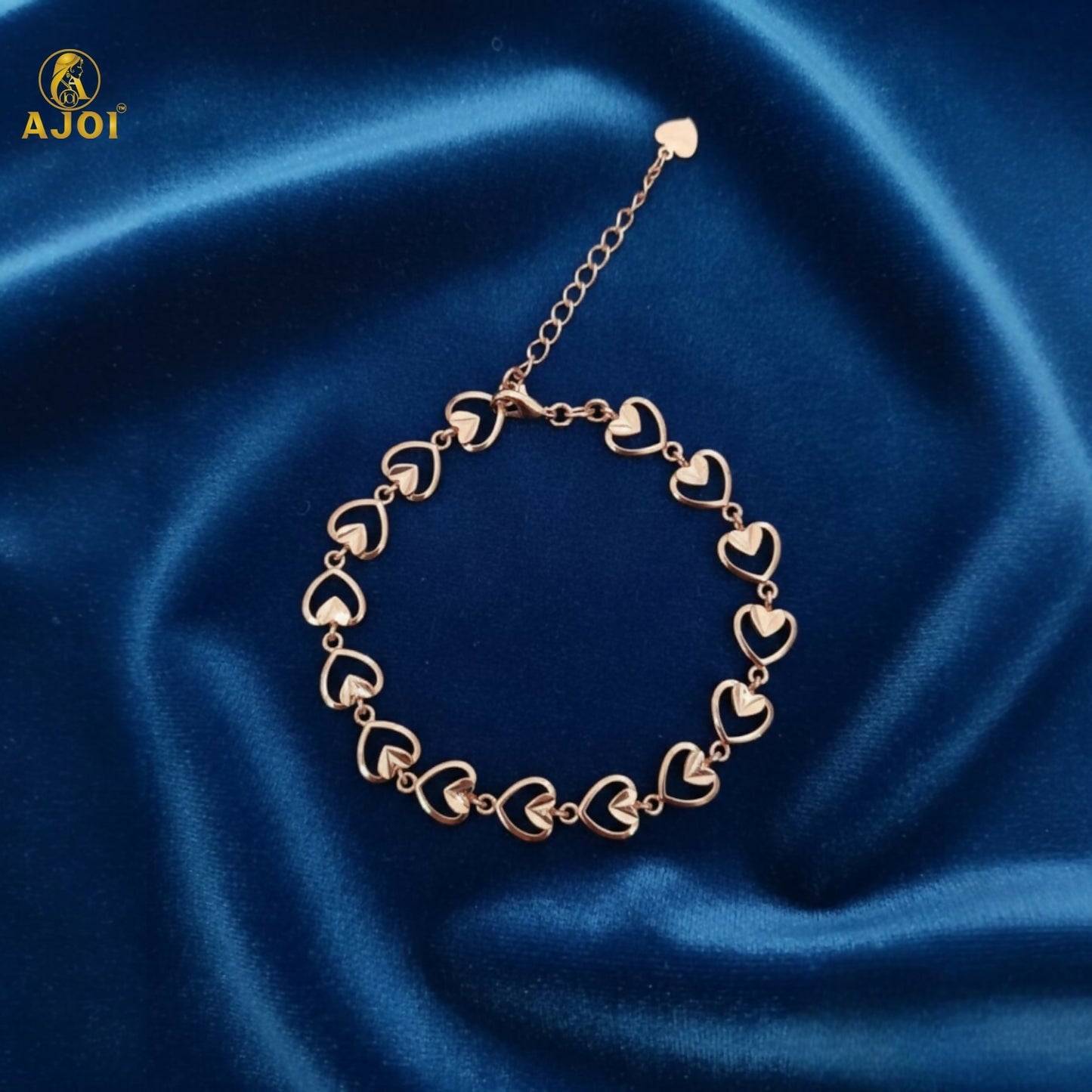 Side view of delicate heart link gold plated bracelet for women