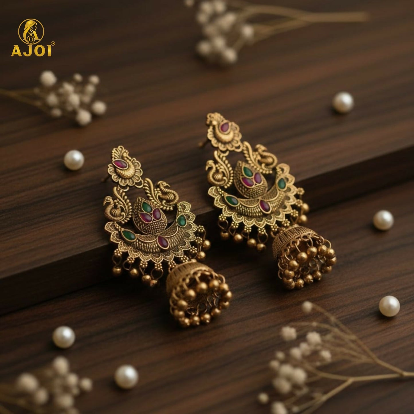 Peacock motif on gold plated jhumka earrings with colorful stones