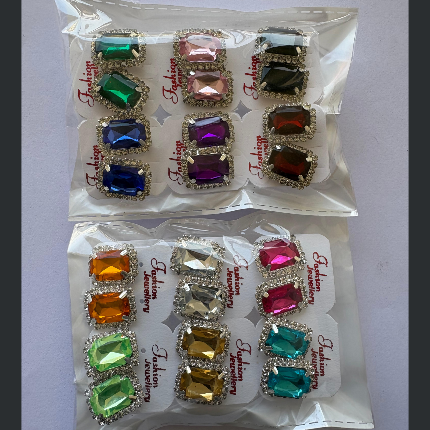 Graphic showing '12 PAIRS' & 'EMERALD CUT' for crystal stud earrings.
