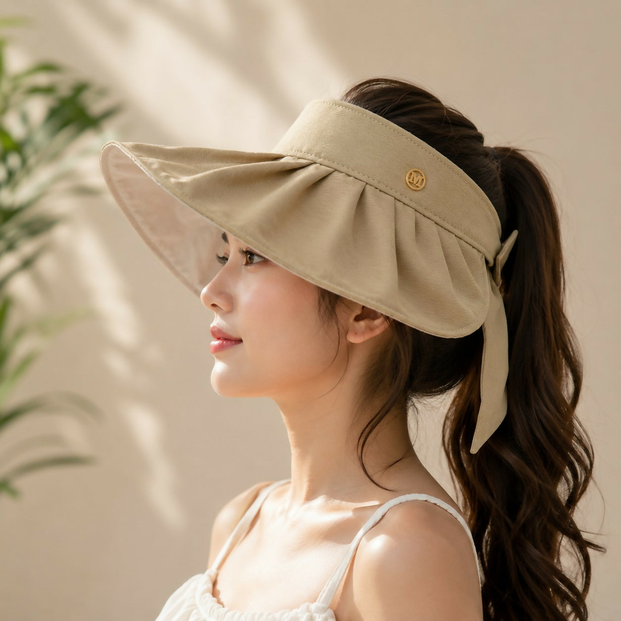Women wearing beige wide brim sun visor cap outdoors