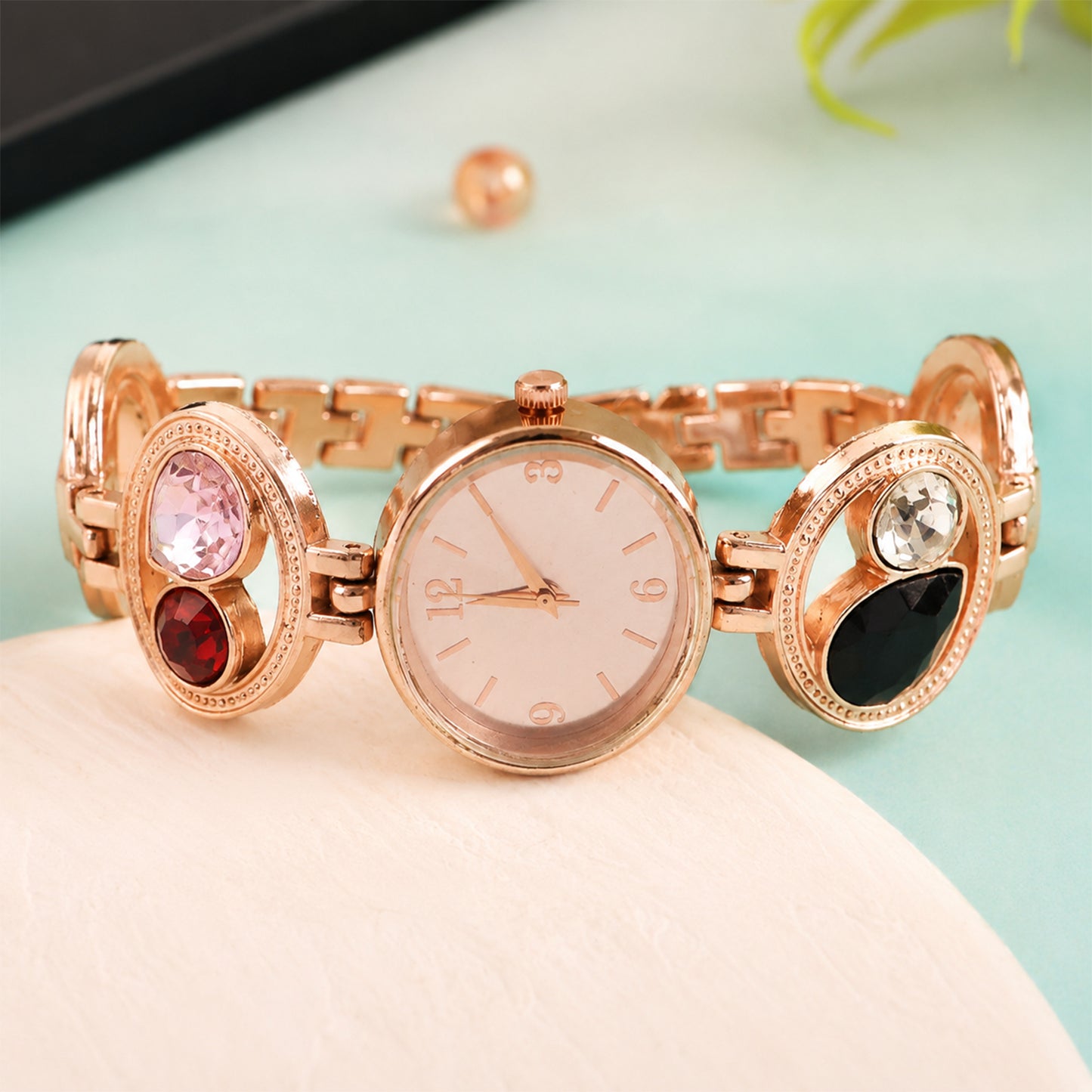 Women's wrist wearing the rose gold analog watch, showcasing its fit.