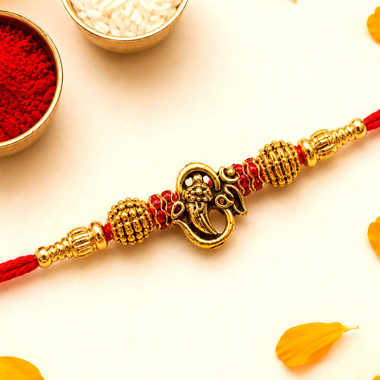 Traditional Ganesha Charm Beaded Rakhi for Brother with vibrant beads.