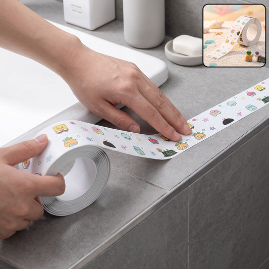 Hands applying white cartoon-printed sealing tape around a bathroom sink edge, with a small inset showing the tape on a