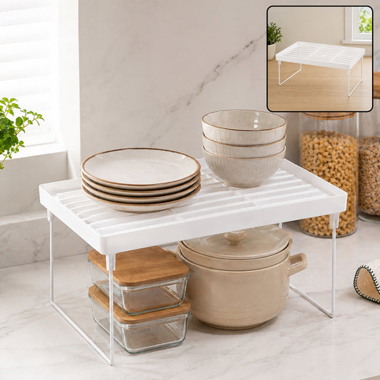 White foldable plastic storage rack on a kitchen counter, holding plates, bowls, and glass containers. A small inset shows