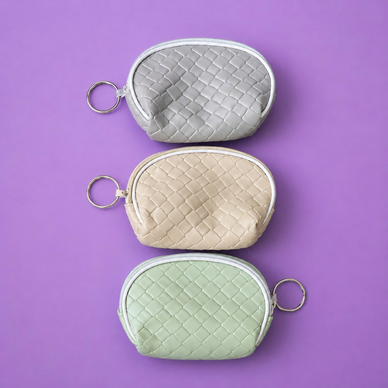 Random color mini pouch displayed on wooden surface