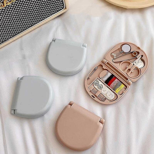 Mini portable travel sewing kit with scissors and threads