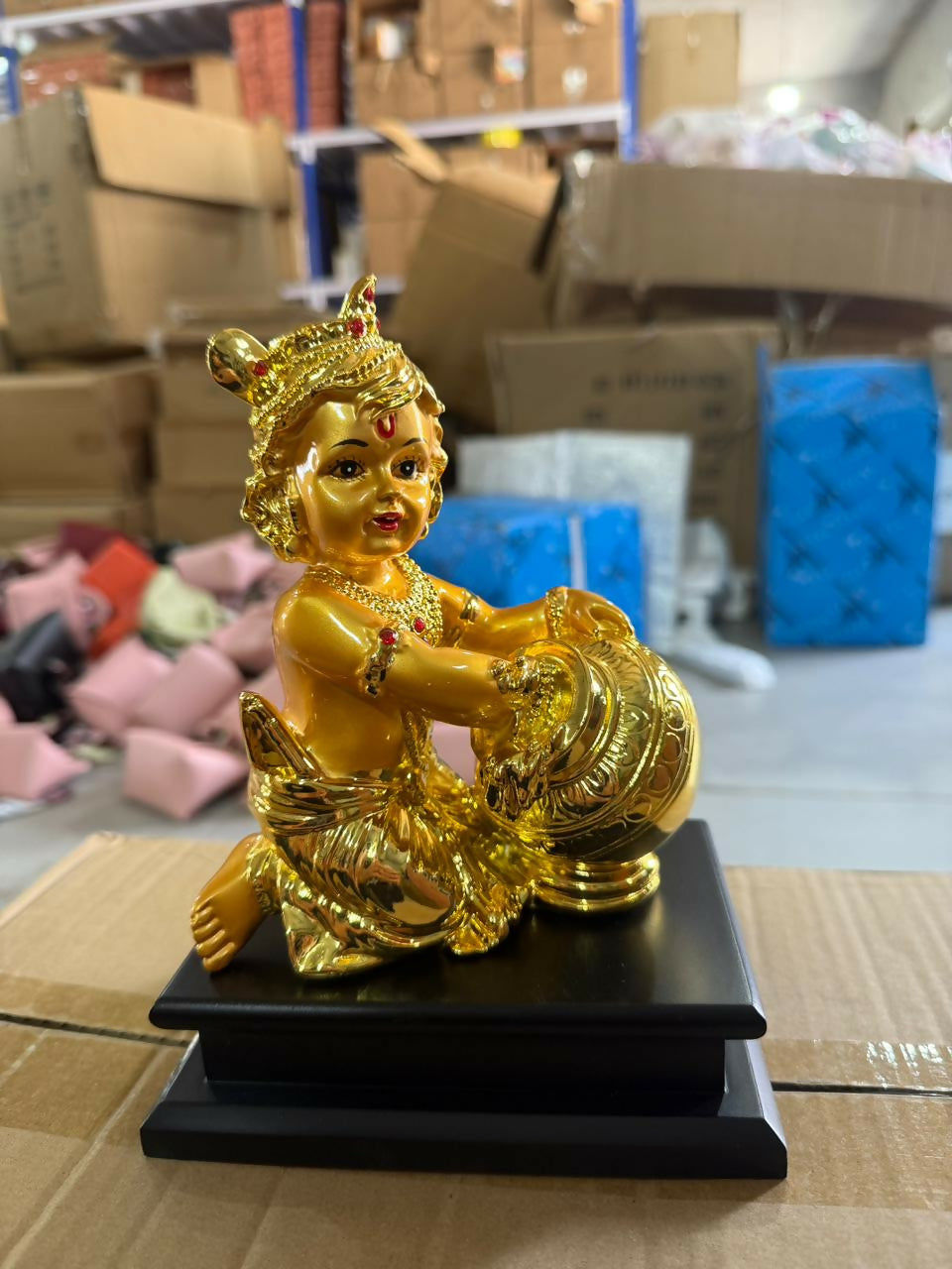Front view of golden Bal Krishna butter pot idol for home temple
