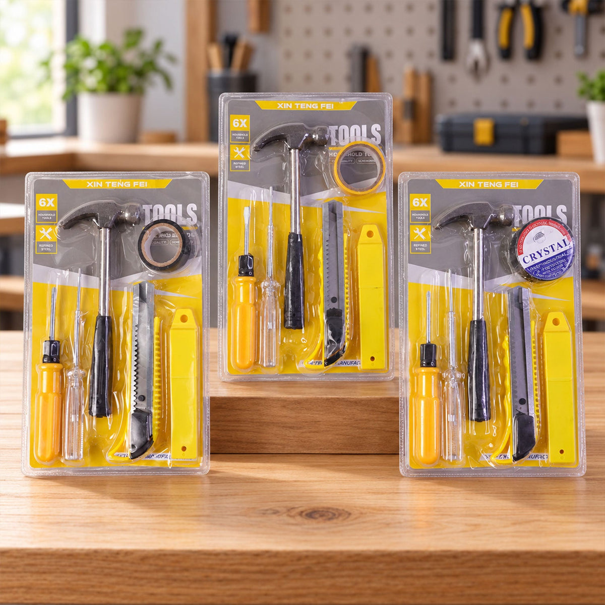 Three identical 6-in-1 household tool kits, each sealed in clear plastic packaging, stand upright on a wooden surface.