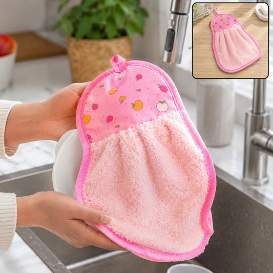 Hands drying a white plate with a pink microfiber hand towel featuring a fruit print top and hanging loop over a kitchen