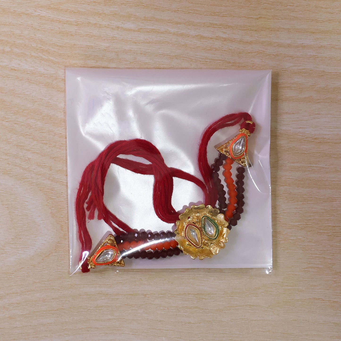 Red Beaded Floral Rakhi with Golden Center and Traditional Festive Gift Appeal Ideas