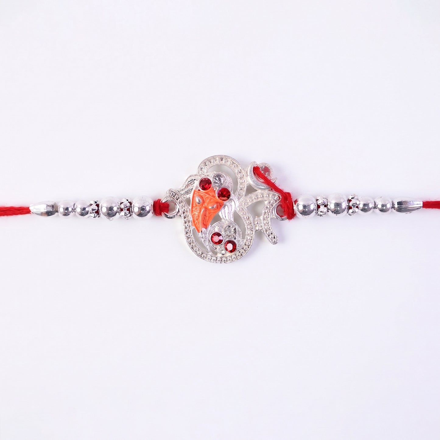 Silver Om Ganesh Rakhi with Red Stones and Metal Bead Chain
