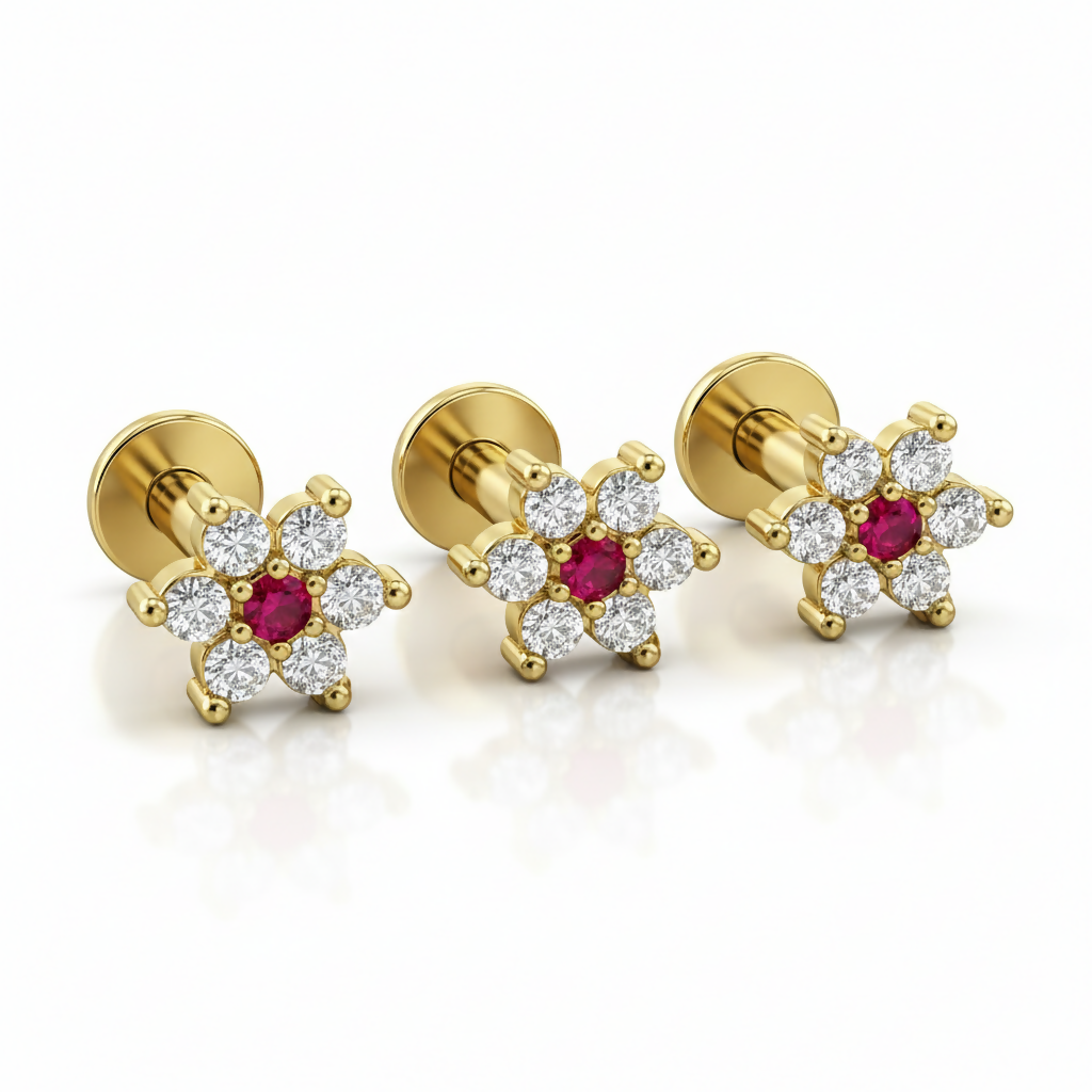 Pack of three gold plated flower labret studs with ruby and crystal floral design