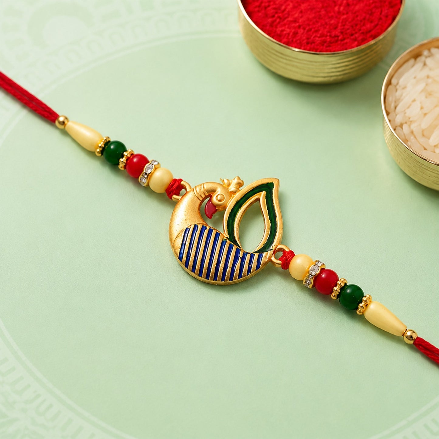 Vibrant handcrafted Peacock Feather Rakhi featuring intricate feather design for Raksha Bandhan.
