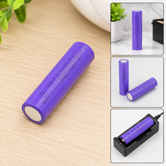 A purple lithium-ion battery with white ends rests on a light wooden surface next to green plants.