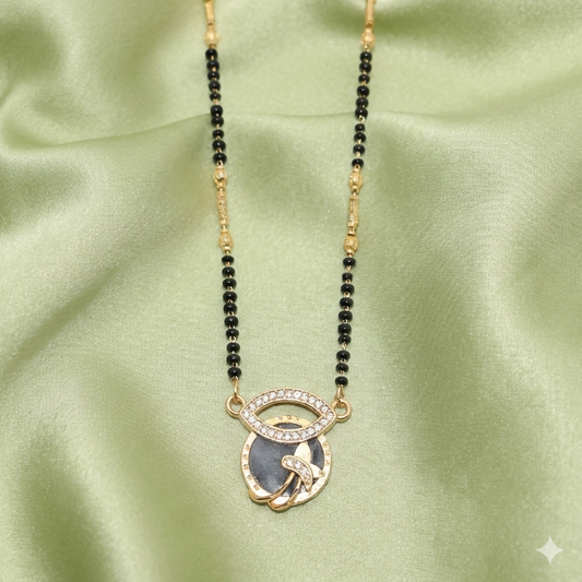 Gold-plated evil eye mangalsutra featuring a floral pendant and black beads