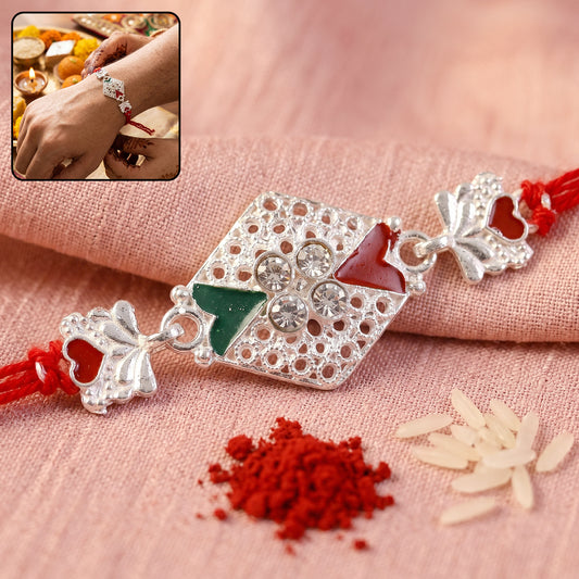 Silver Elephant Charm Rakhi with red and green stones and crystals