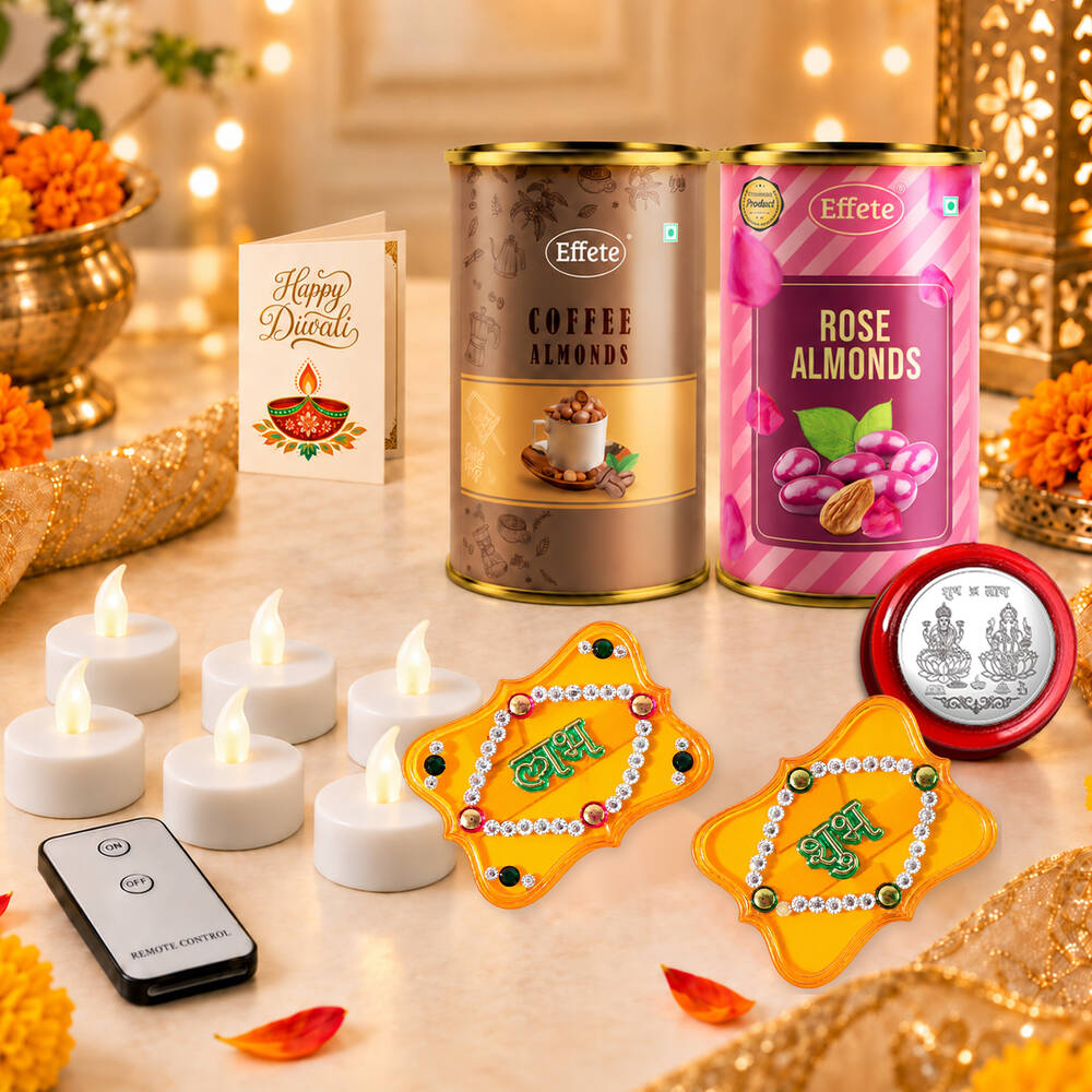 A festive arrangement of a blue gift box, almond tins, a greeting card, LED candles, and yellow decorations.