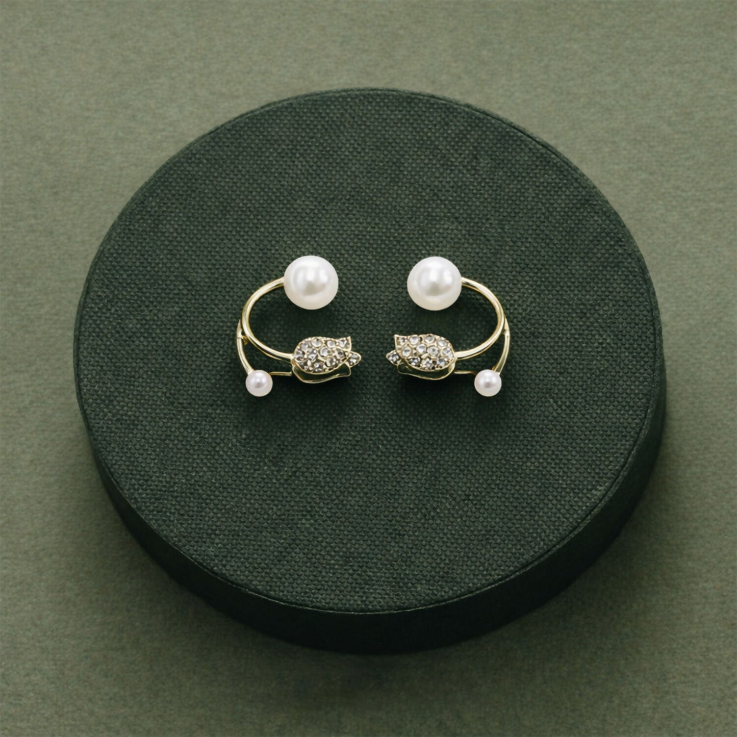 Pearl and stone stud earrings worn by model