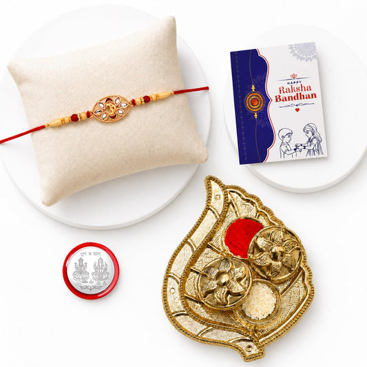 OM Rakhi Combo gift set with a decorative rakhi, leaf design pooja thali, and other festive items.