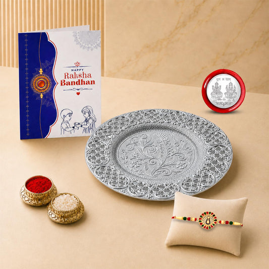 Multicolor Raksha Bandhan gift hamper with peacock rakhi and silver pooja thali set.