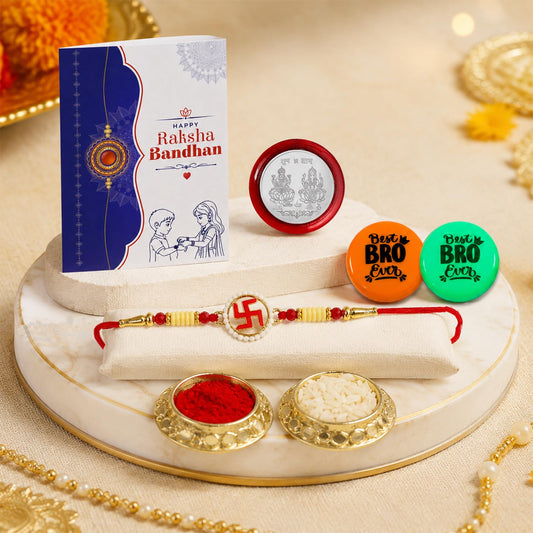 Swastika multicolor rakhi combo with decorative magnets, roli chawal, pooja coin and greeting card.