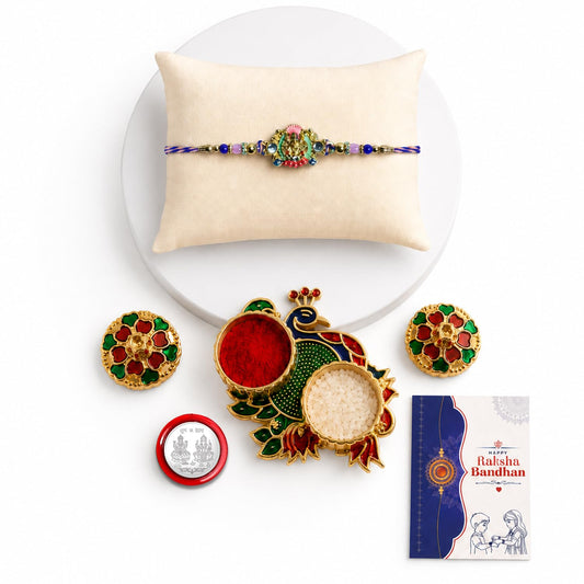 Multicolor Ganesha Rakhi combo gift set with peacock pooja thali, coin, and greeting card.