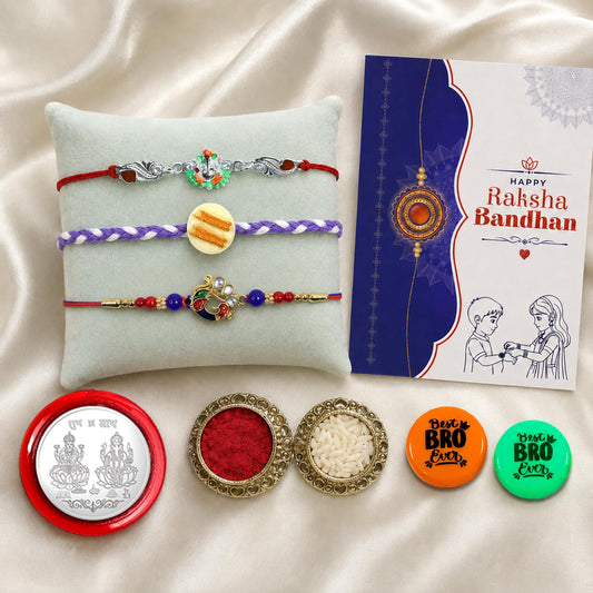 Multicolor Raksha Bandhan Gift Combo with Ganesh charm rakhi, decorative magnets, roli chawal, and coin