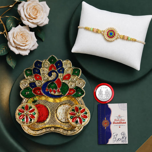 Multicolor round floral bracelet Rakhi with peacock thali, silver coin, and greeting card for Raksha Bandhan.
