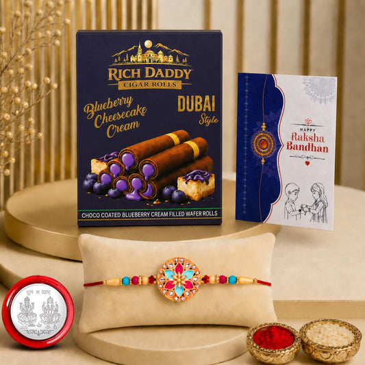 Full Rakhi Gift Combo set featuring a round multicolor rakhi and blueberry cream wafer rolls.