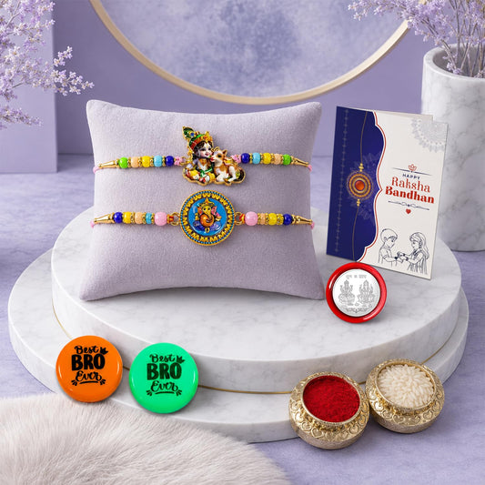 Krishna Ganesh multicolor Rakhi gift combo for brother with decorative magnets, roli chawal, pooja coin, and greeting card.
